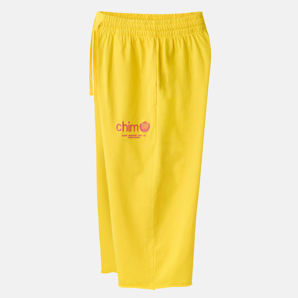 HMDD Yellow Program 3/4 Shorts, angled view of the yellow cropped shorts showing the elastic waist and red chim smiley logo