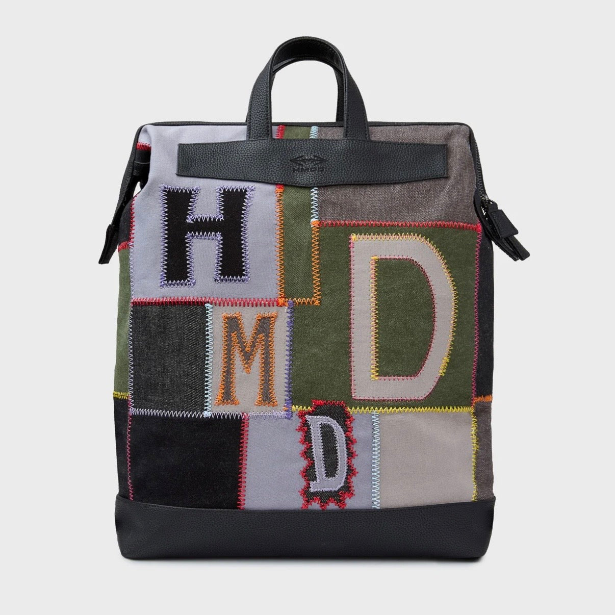 HMDD Hopscotch Box Bag, front view of the patchwork bag with H, M and D letters, black top handle and buckle straps