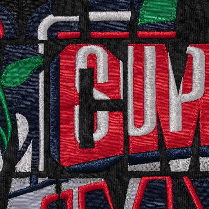 Close-up of the stitched fabric applique and rose artwork on the Supreme Black Blessed Applique Zip Hoodie