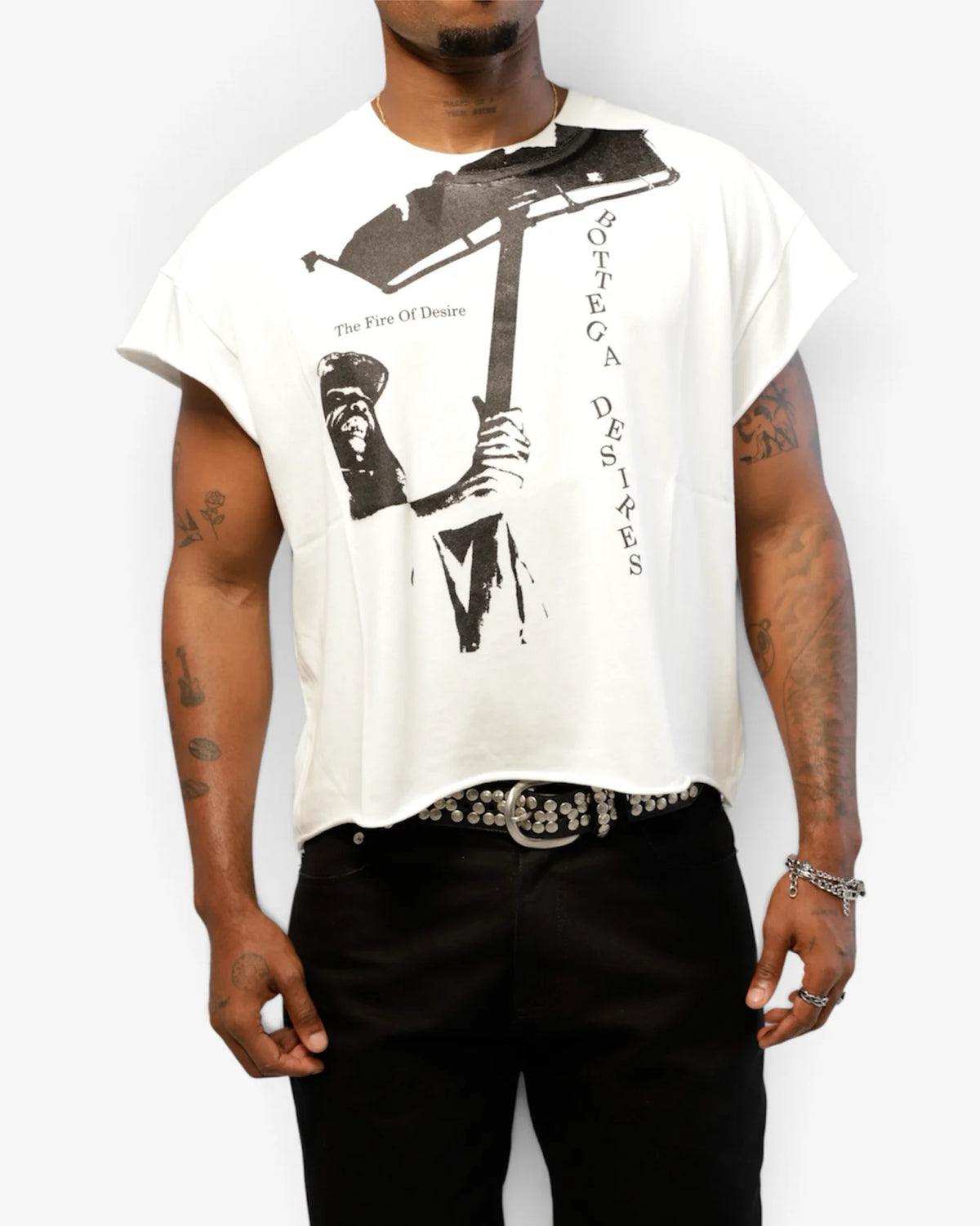 Close torso shot of male model wearing the white torch-print cut-off tee