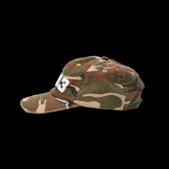 Side profile of the woodland camo dad hat with curved brim and RHO3 lettering