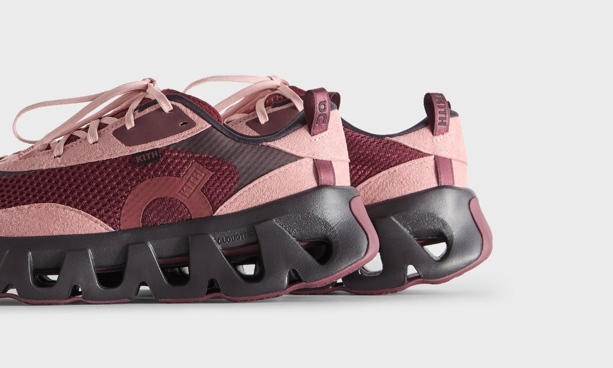 Kith On Running K-Tech 2 Ruby Ox, close crop of the pair showing the ribbed black sole and pink heel tab
