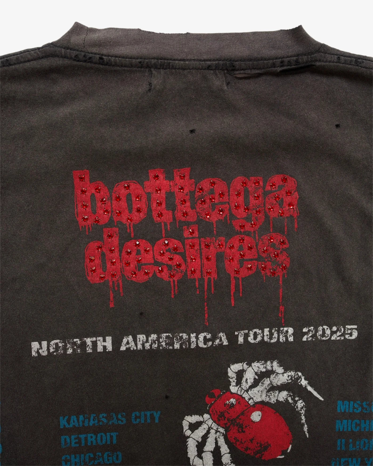 Close-up of the Obituary tee back print: red dripping logo, NORTH AMERICA TOUR text and spider graphic