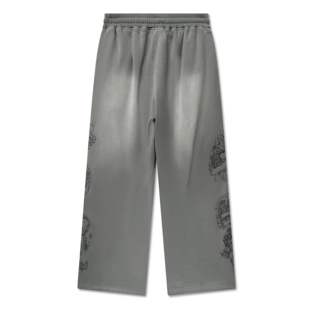 Back of washed grey wide-leg sweatpants with faded gradient and tonal prints