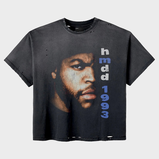 HMDD Friday Tee front — washed black tee with a large photo portrait of a bearded man in a beanie and hmdd 1993 text