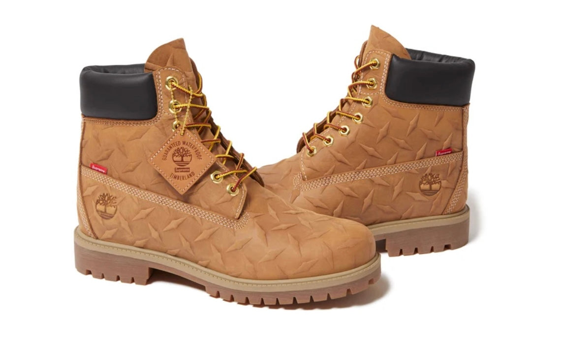 Timberland Supreme Wheat Diamond Plate 6" Boot, pair of wheat nubuck 6 inch boots with an embossed diamond plate pattern, black padded collars and red Supreme tabs