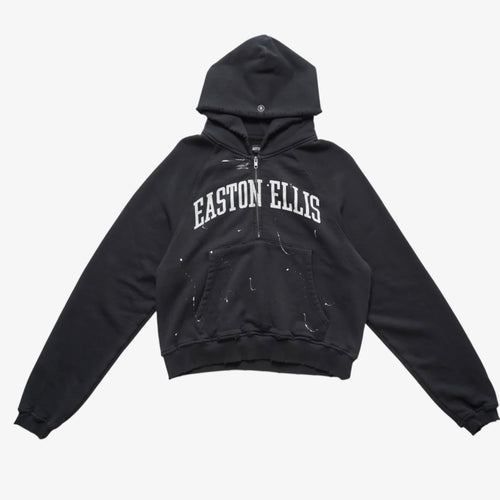 Bottega Desires Easton Ellis hooded half zip in washed black with white arched EASTON ELLIS lettering and white paint splatter, front view