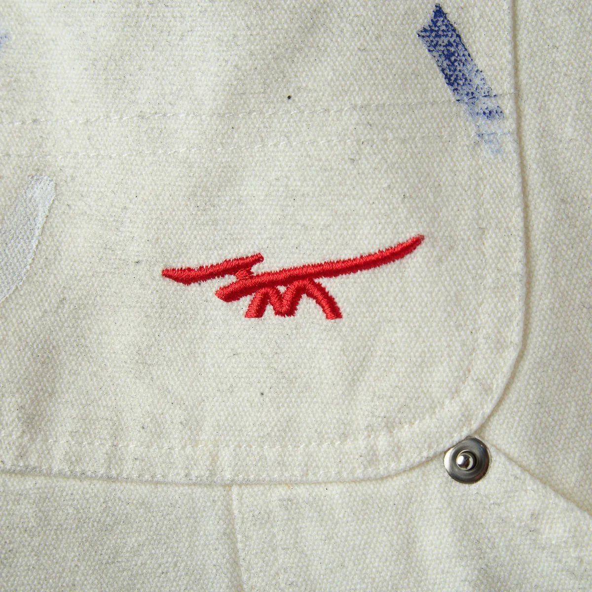 HMDD Big Ed Work Pants, close-up of the red embroidered logo on the front pocket