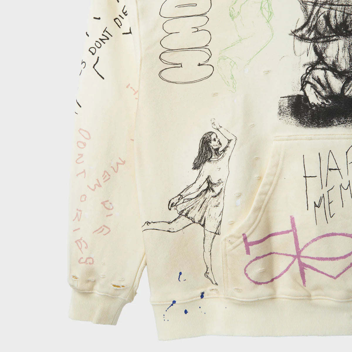 HMDD Sketch Hoodie, close-up of the opposite sleeve and pocket with a dancing figure, pink lettering and a purple scribble graphic