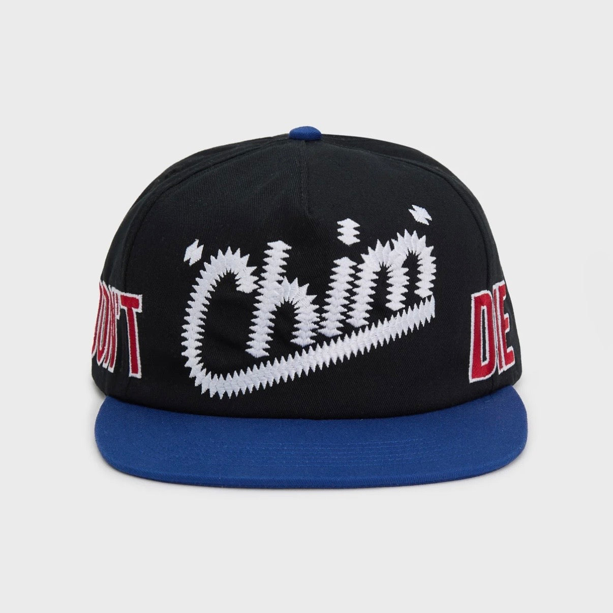 HMDD Chocolate City Hat, front view of a black crown with white and red DON'T 'Chim' DIE lettering and a royal blue brim
