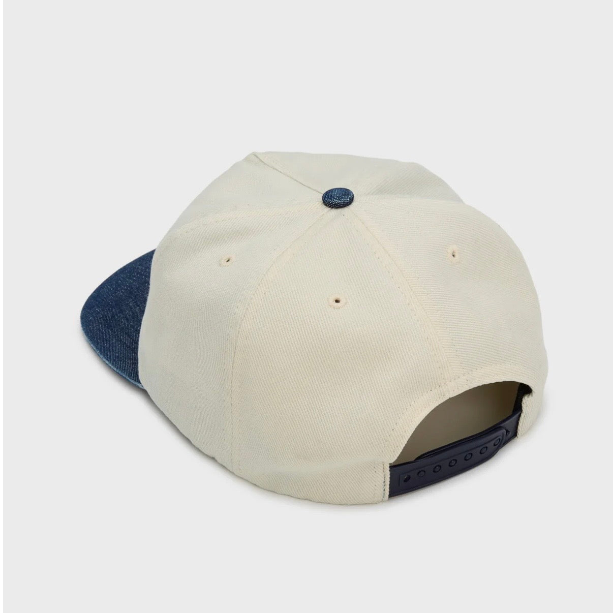 HMDD Chim Air Hat, back view of the cream five-panel crown with the denim brim visible below