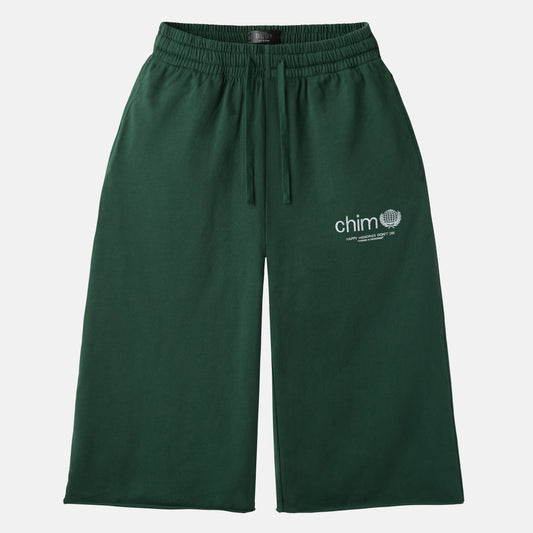 HMDD Green Program 3/4 Shorts, dark green knee-length shorts with a drawstring waist and a white chim globe print on the thigh