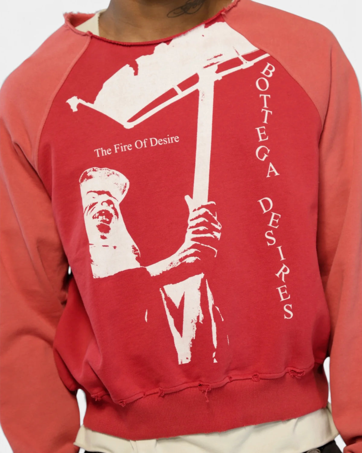 Close-up of the Fire Of Desire front graphic and two-tone washed red fabric