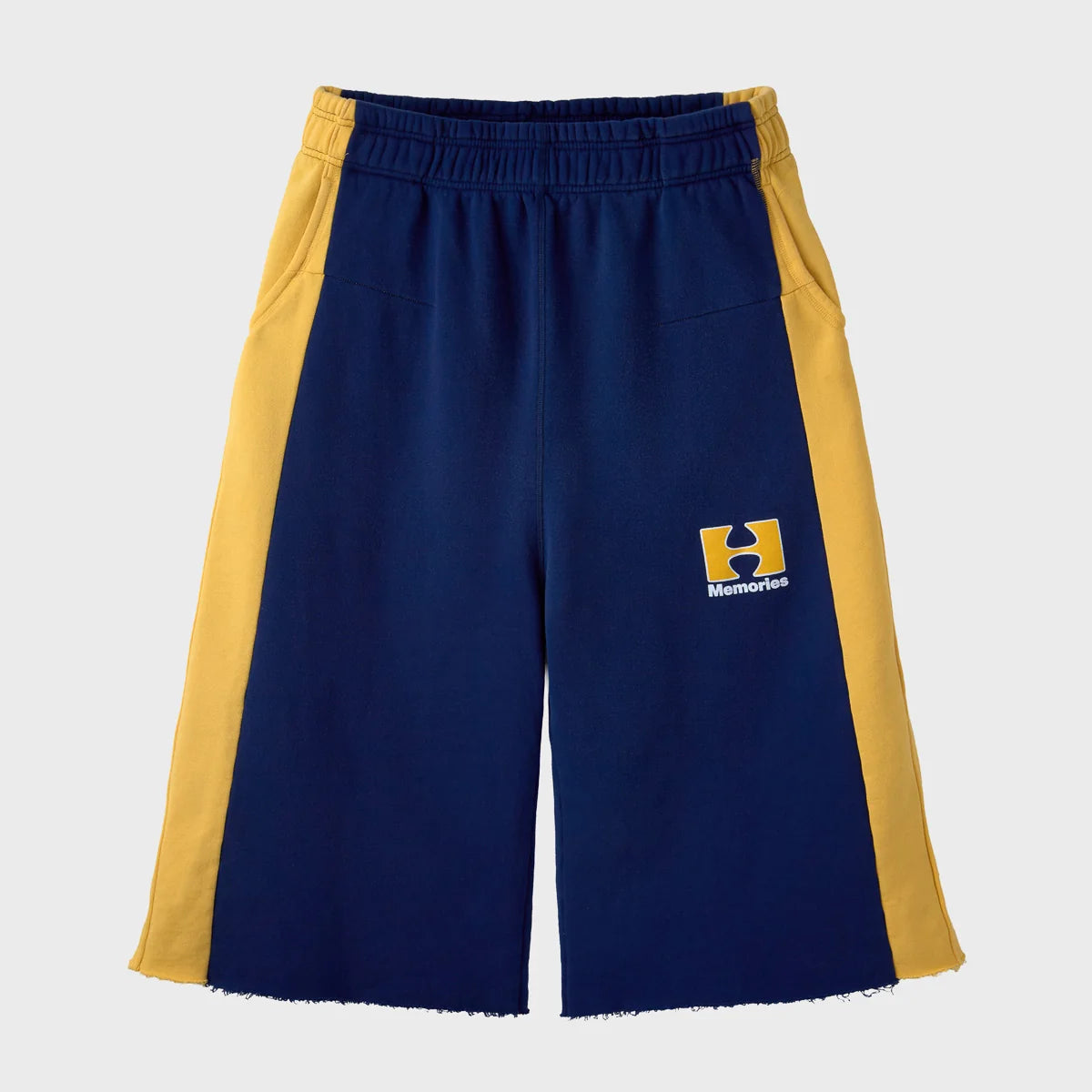 HMDD Pear Tech 3/4 Shorts front view in navy with gold side panels and raw-cut hems