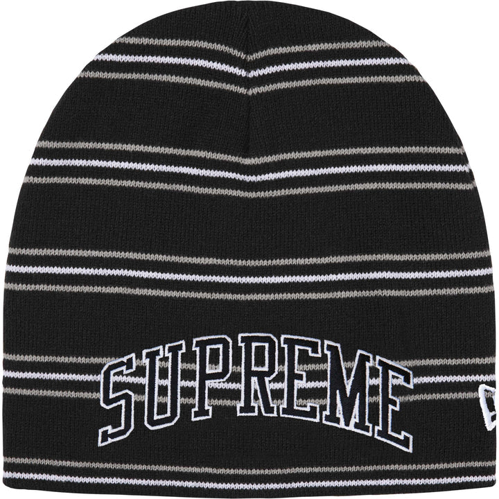 Supreme New Era striped beanie in black with grey and white stripes, arched SUPREME lettering and a New Era flag