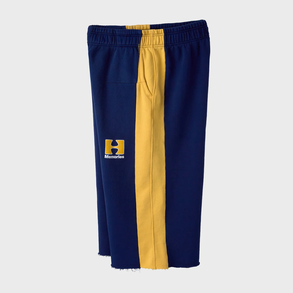 HMDD Pear Tech 3/4 Shorts side view showing the gold panel running the full leg