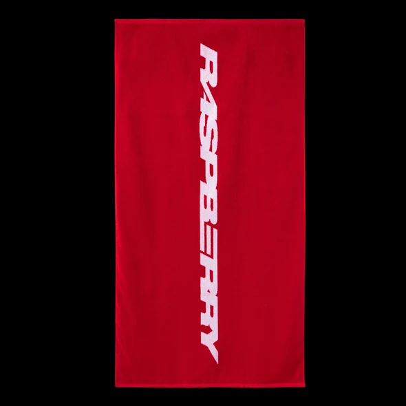 GV Gallery Red Beach Towel, red terry towel with a white vertical Raspberry wordmark