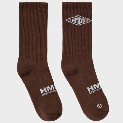 HMDD Brown Crew Socks, pair of ribbed brown crew socks with a white arrow logo at the cuff and a white wordmark up the ankle