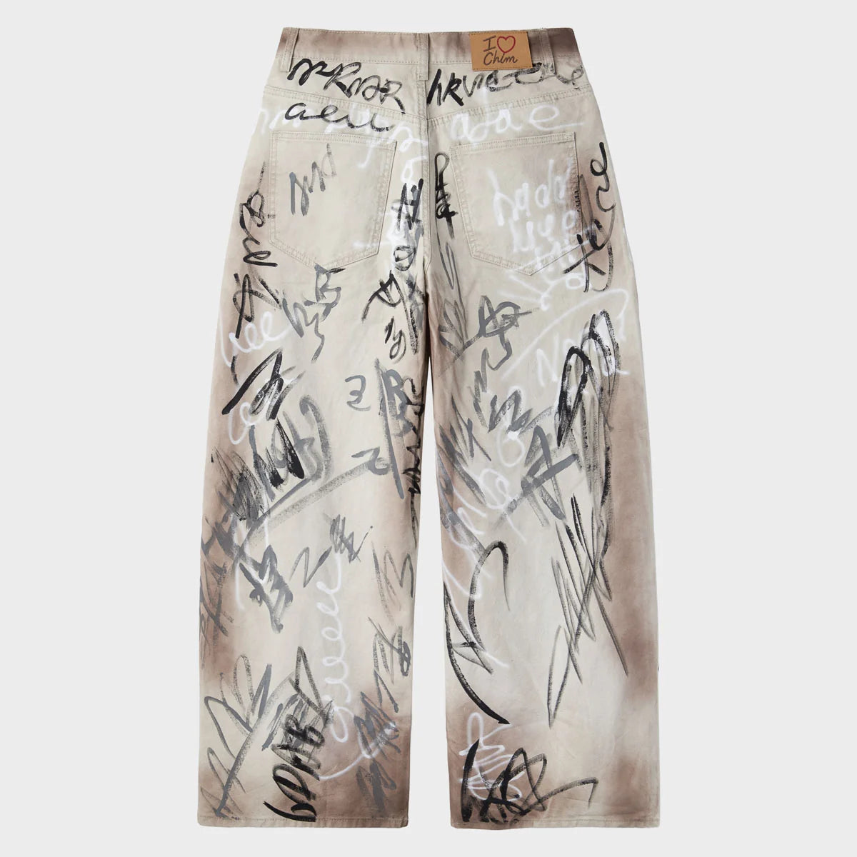 Back of baggy ecru graffiti canvas trousers with patch pockets and waistband patch