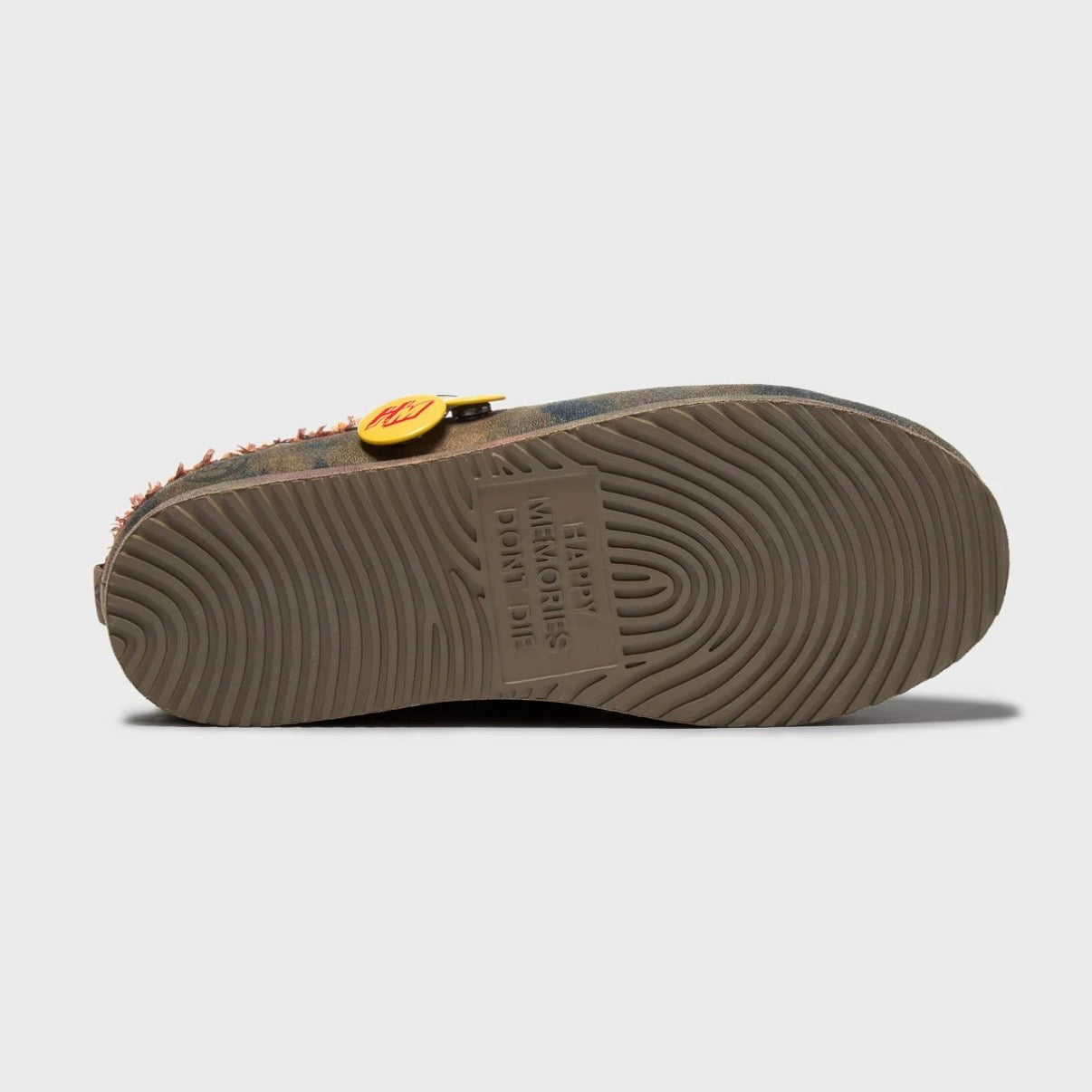 HMDD Graffiti Mule, underside of the clog showing the ridged brown rubber outsole