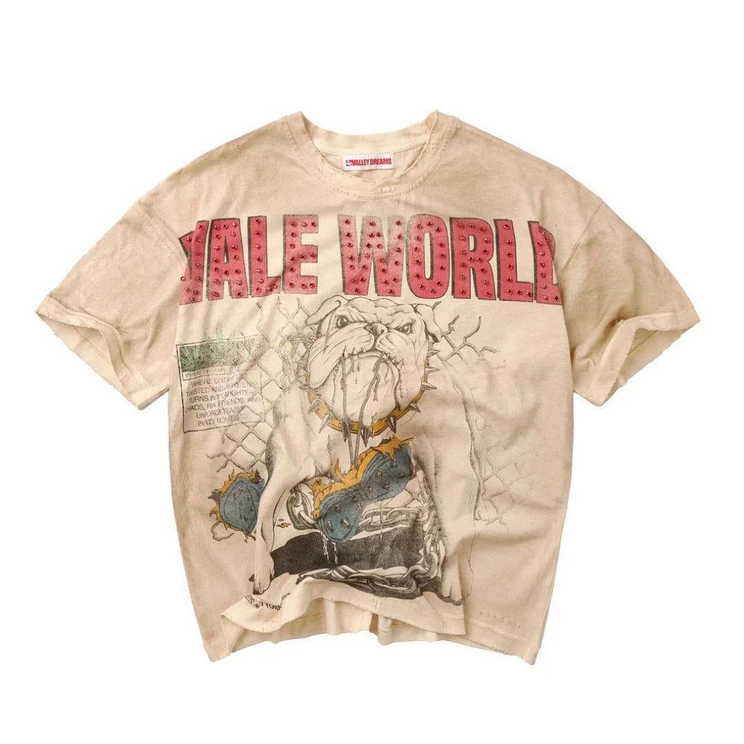 Vale cream washed tee, front with red studded VALE WORLD lettering over a sketched bulldog behind a chain-link fence