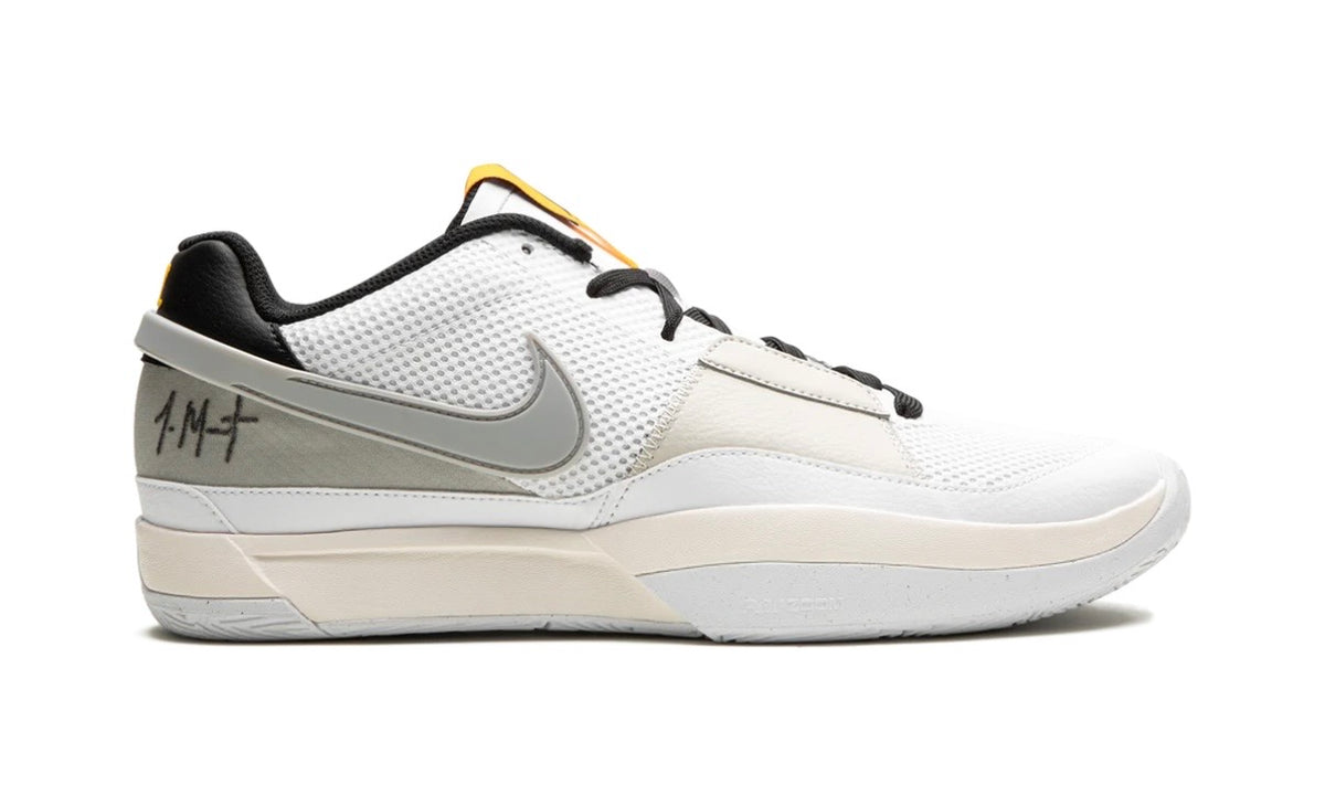 Nike Ja 1 Light Smoke Grey, medial side profile showing the grey Swoosh, cream midsole band and black collar