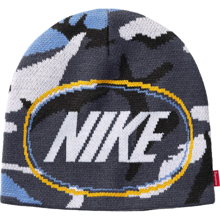Supreme x Nike Oval beanie in blue, navy and white camo knit with a white NIKE logo inside a yellow oval