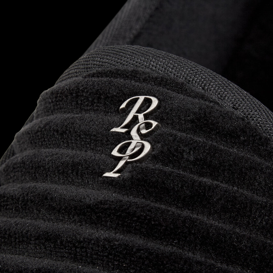 GV Gallery Deebo Slippers close-up of the silver script monogram on the vamp