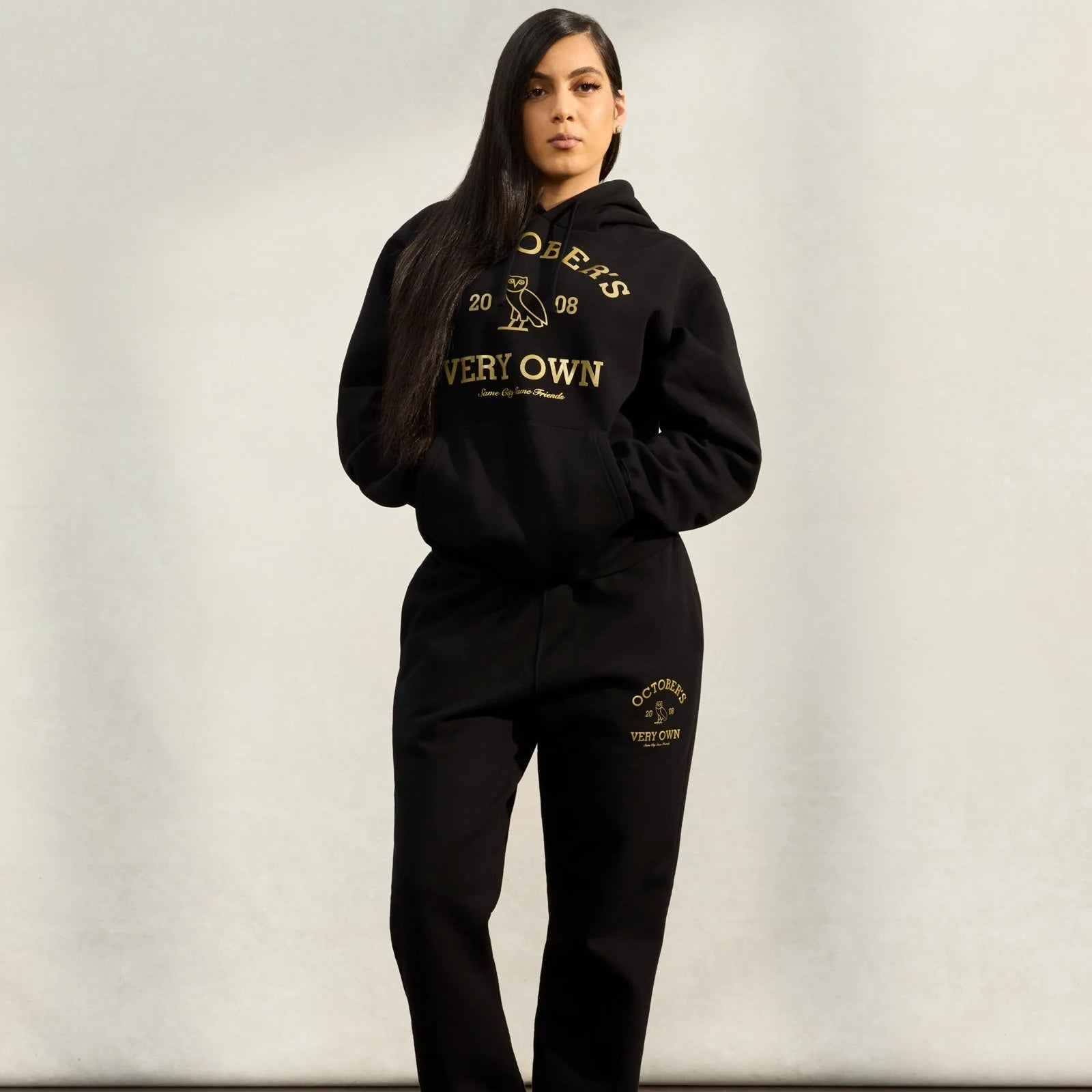 OVO Black Gold Collegiate Hoodie On Body 4