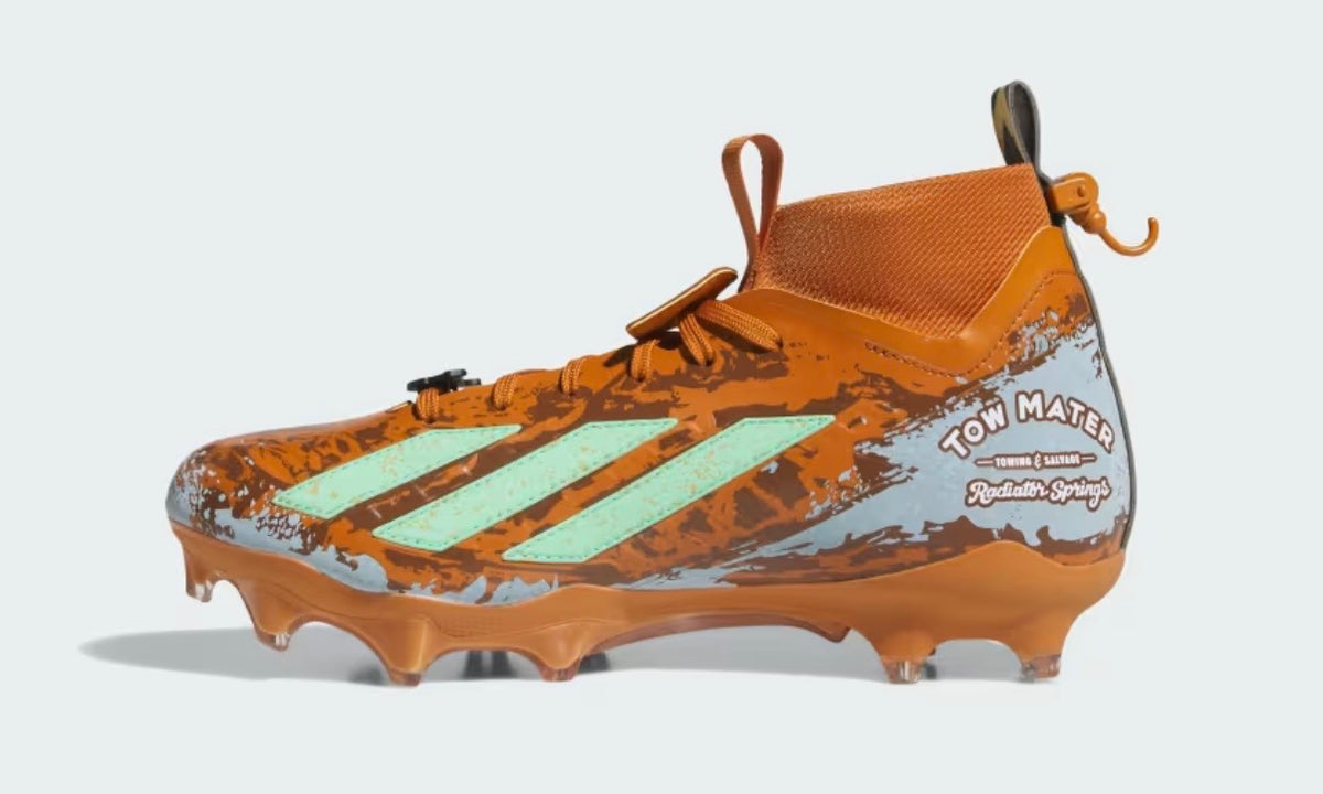 Adidas Pixar Cars Adizero Impact II cleat lateral profile — rust orange upper, TOW MATER decal, mint stripes