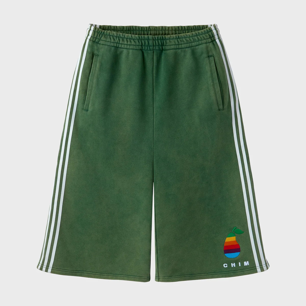HMDD Pear Tech 3/4 shorts in washed green fleece, front view, with three white stripes down each side seam and a rainbow pear embroidery above the left hem