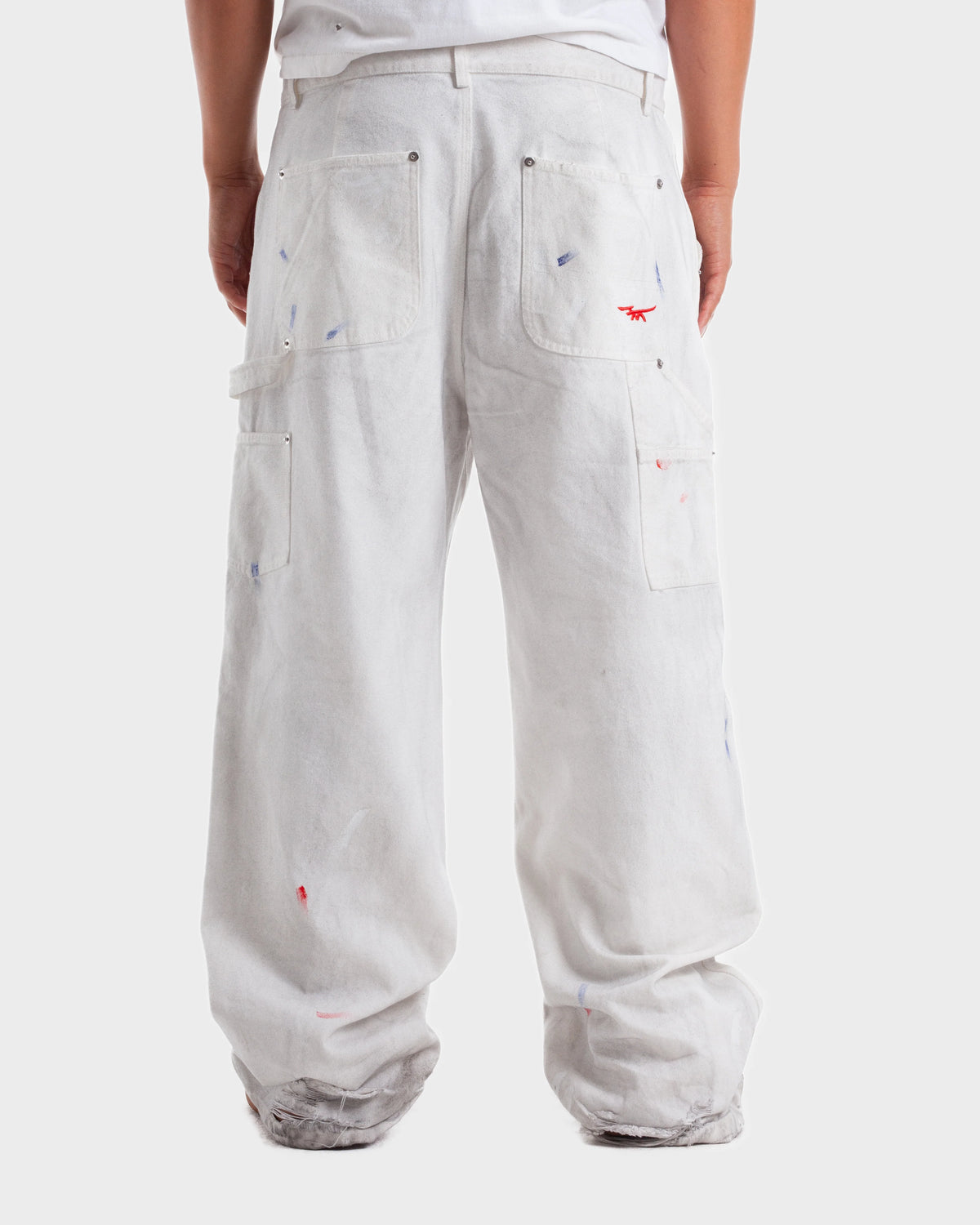 HMDD Big Ed Work Pants, on-model back view showing the baggy fit and frayed hems