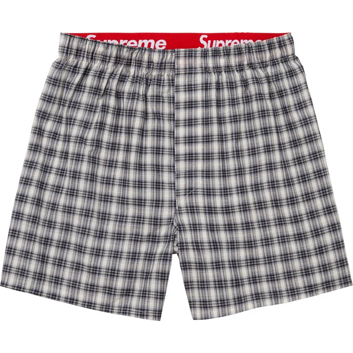Supreme Multicolor Plaid Boxers flat lay in black and white plaid with the red Supreme waistband