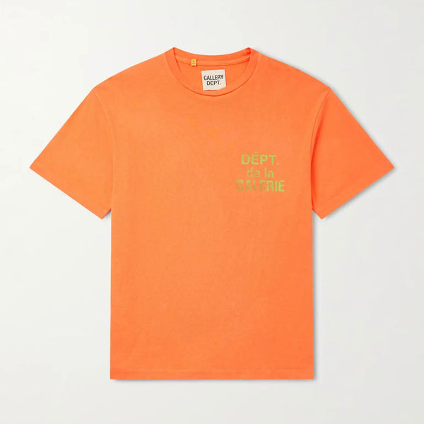 Gallery Dept Orange French Logo T-Shirt, bright orange tee laid flat with a green Dept de la Galerie chest print