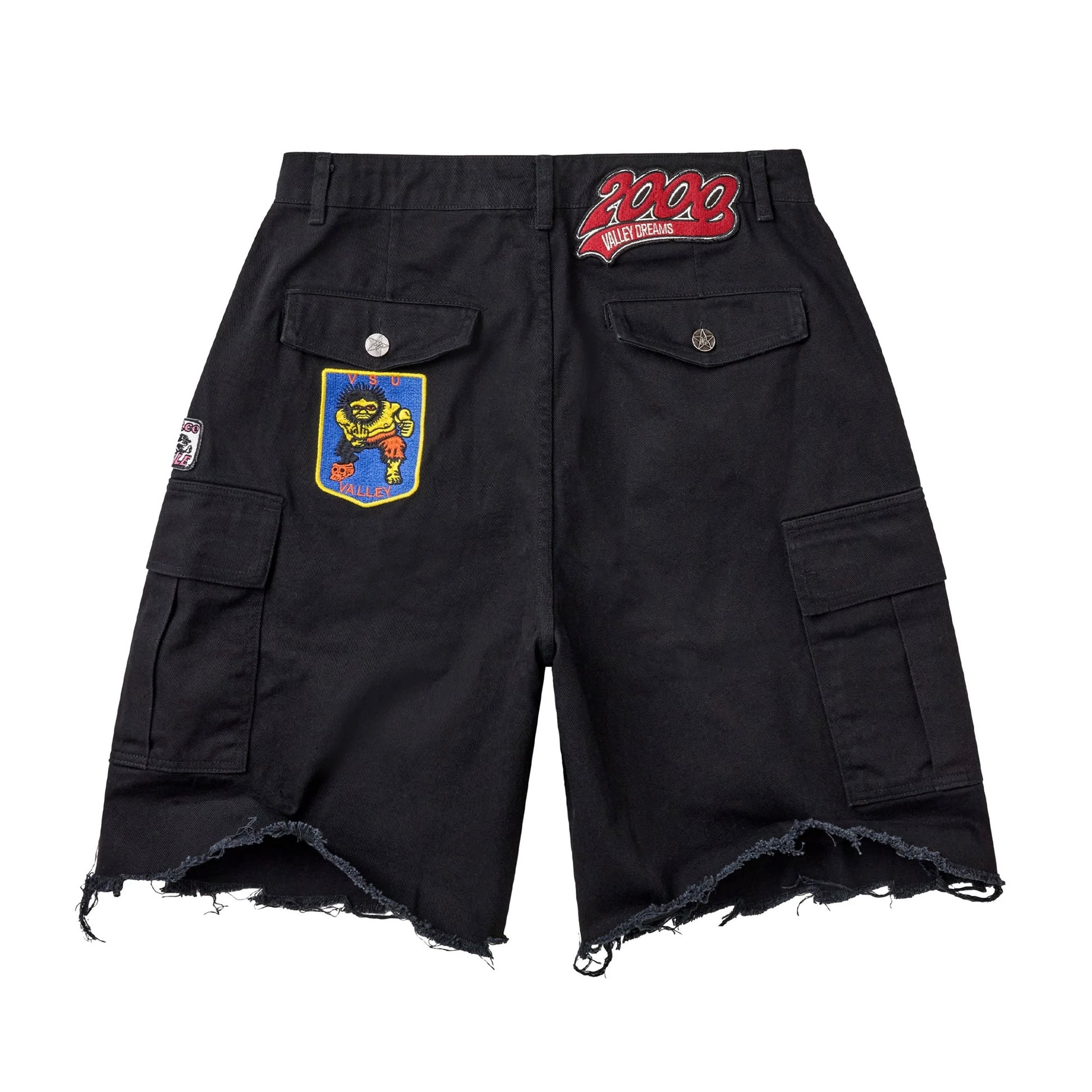 Vale Fest Black Cargo Jorts, back view showing two flap pockets, a red script patch at the waistband, a blue and yellow crest patch on the pocket and the raw frayed hem