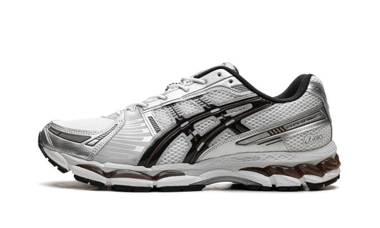 Asics Gel-Kayano 12.1 White Graphite Grey Brown, side view of a white and silver upper with black stripes and brown outsole