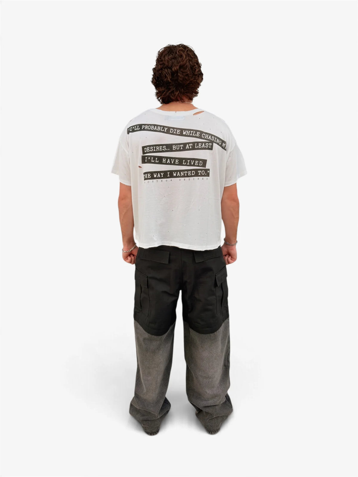 Model wearing the off-white Interview tee with two-tone wide pants, back view