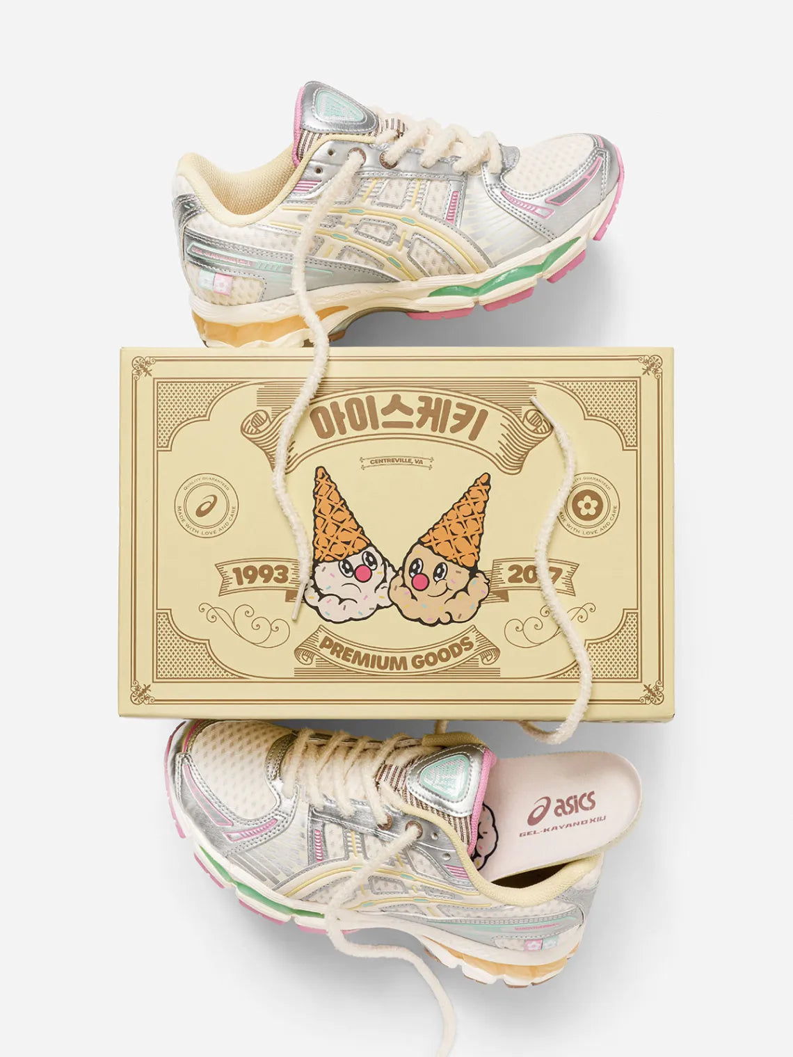 Vandy The Pink Asics Gel-Kayano 12.1 Vanilla, flat lay of the pair around a cream box printed with ice cream cone characters