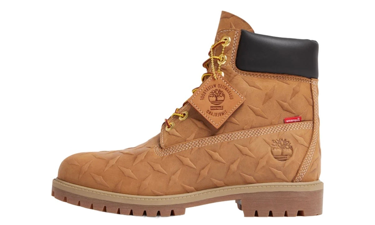 Timberland Supreme Wheat Diamond Plate 6" Boot, side view of the wheat boot with gold eyelets and Timberland hang tag