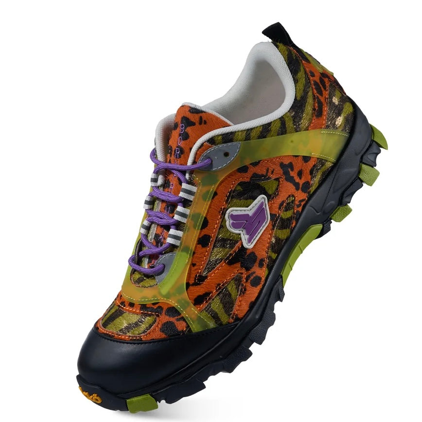 Sicko x xVessel Tiger Orange hiking shoe, front three-quarter close view of the black toe cap and purple logo