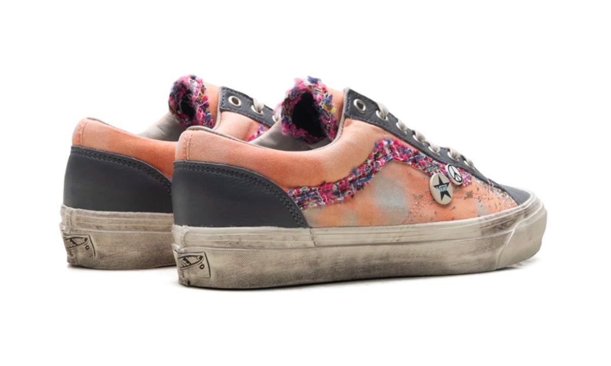 Rear three-quarter of peach and grey Vans Old Skool pair with pink tweed collar trim