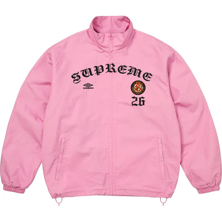Supreme x Umbro cotton ripstop track jacket in pink with black gothic SUPREME arch, Umbro diamond logo, crest patch and 26, front view
