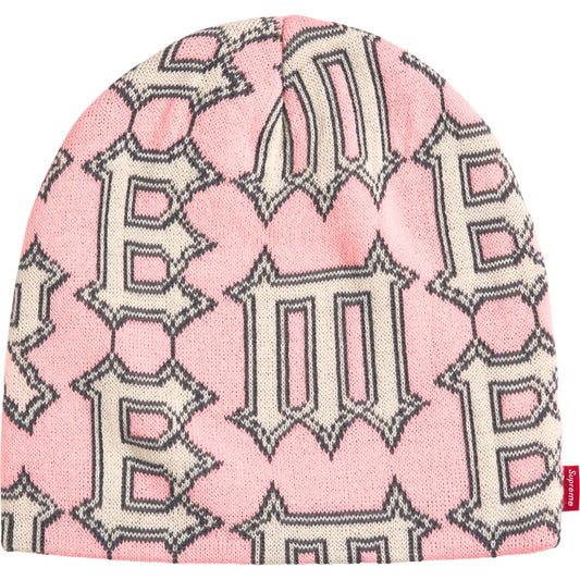 Supreme Spike beanie in light pink with allover cream gothic Supreme letters outlined in charcoal