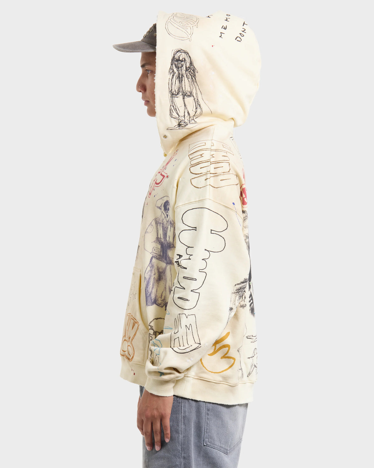 HMDD Sketch Hoodie, side profile of the model showing sleeve drawings and the drawn figure on the raised hood