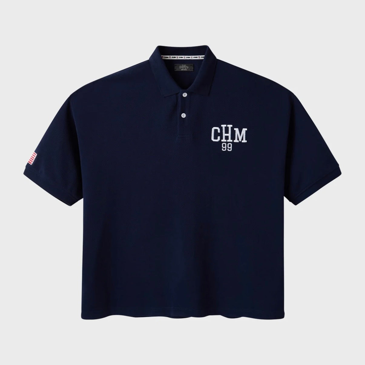 HMDD Glo Navy Polo, front of a navy short-sleeve polo with a white CHM 99 chest logo and a small sleeve patch