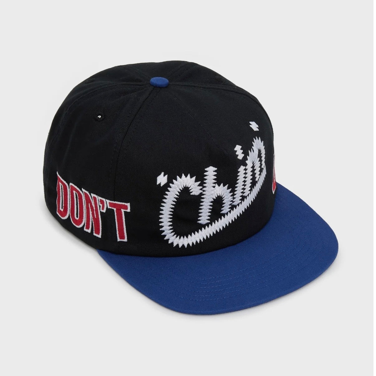 HMDD Chocolate City Hat, angled front view of the black cap, wrap-around red and white lettering, royal blue brim