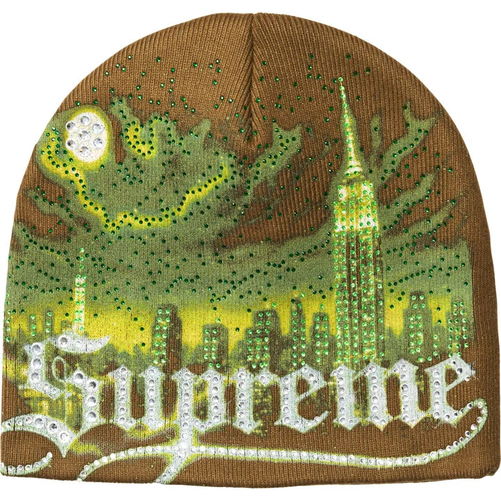 Supreme Cityscape beanie in brown with a green rhinestone city skyline, moon and white rhinestone Supreme script across the front
