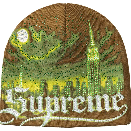 Supreme Cityscape beanie in brown with a green rhinestone city skyline, moon and white rhinestone Supreme script across the front
