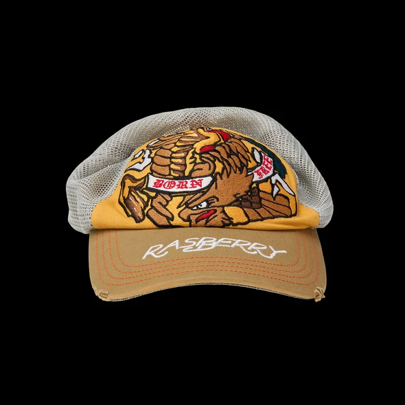 Front view of the gold and cream mesh trucker cap with eagle and BORN FREE banners