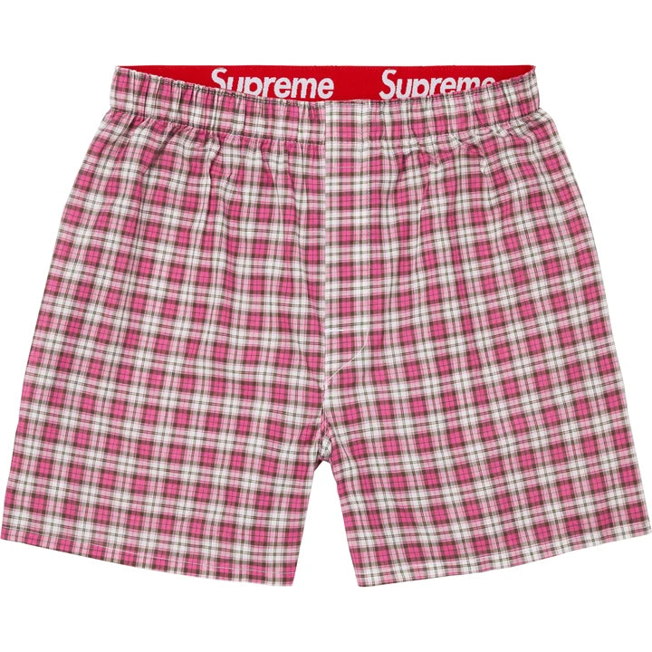 Supreme Multicolor Plaid Boxers flat lay in pink and white plaid with the red Supreme waistband
